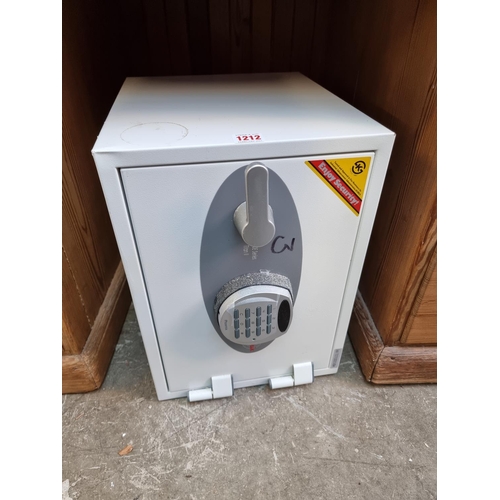 1212 - A Sentry safe, with digital lock, 41cm high x 30.5cm wide x 37.5cm maximum depth.