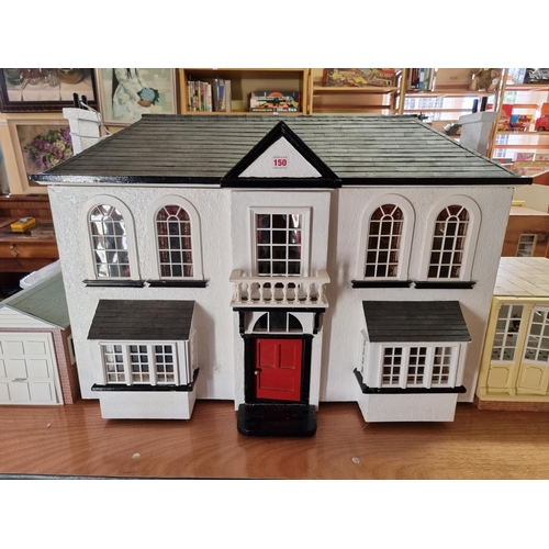 150 - Dolls House: a large two storey wooden doll house, 89cm wide x 62cm high; together with garage and c... 