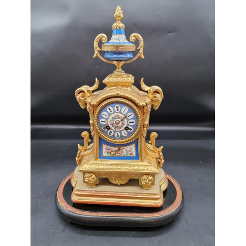 1566 - A late 19th century Louis XVI style, gilt metal and Sevres mounted mantel clock, 36cm high, with pen... 