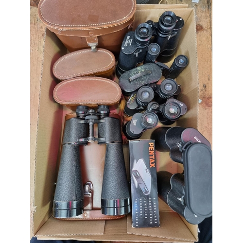 1578 - A collection of binoculars; together with some empty cases. 