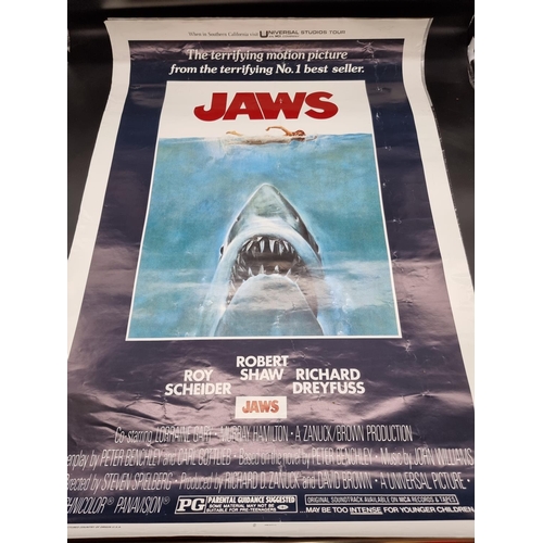 1594 - Movie Posters: a collection, to include Jaws, 101.5 x 68.5cm. (9) 