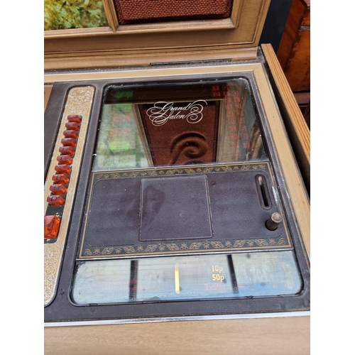 1038 - A vintage Rock-Ola 'Grand Salon' jukebox, 122cm wide.