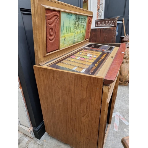 1038 - A vintage Rock-Ola 'Grand Salon' jukebox, 122cm wide.