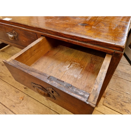 1042 - An Oriental elm low table, 35cm high x 90.01cm wide. 