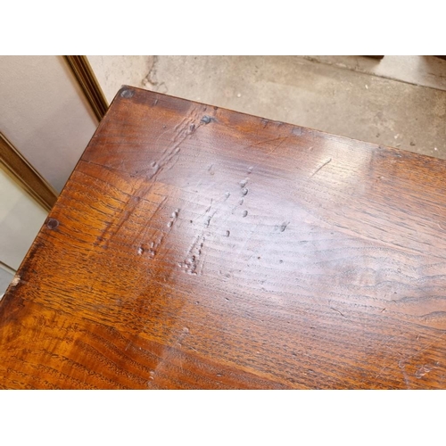 1042 - An Oriental elm low table, 35cm high x 90.01cm wide. 