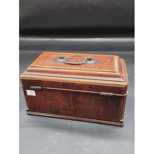 1054 - A George III mahogany and inlaid tea caddy, 26.5cm wide.