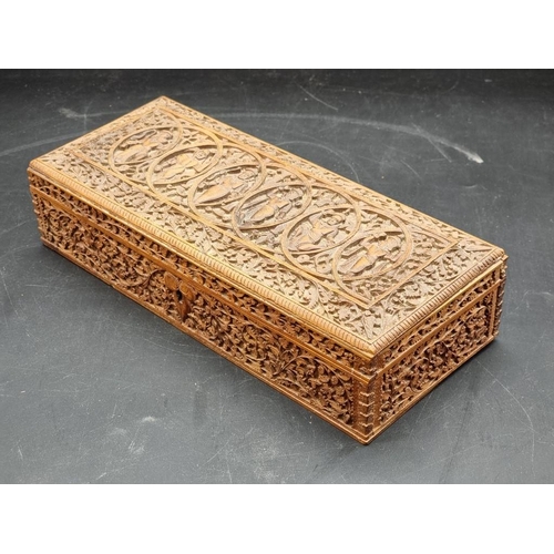 1062 - WITHDRAWN FROM SALE: An eastern carved hardwood rectangular casket, 30.5cm wide.