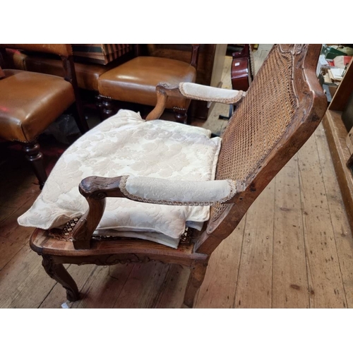 1091 - An antique French walnut and cane fauteuil, in Louis XV style.