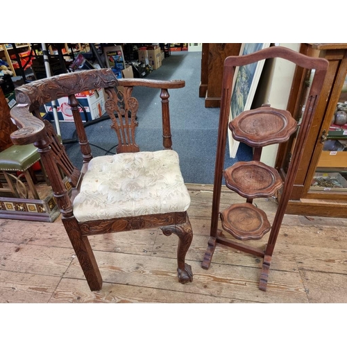 1093 - A George III carved oak corner elbow chair; together with a folding hardwood cake stand. (2)... 