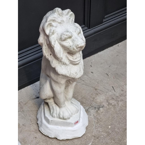 1206 - A pair of white painted composition stone lion gate pier finials, 56cm high.