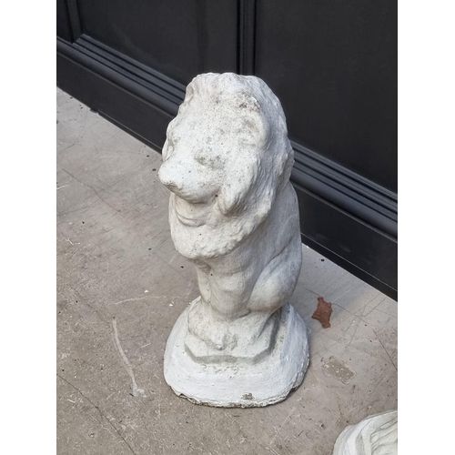 1206 - A pair of white painted composition stone lion gate pier finials, 56cm high.