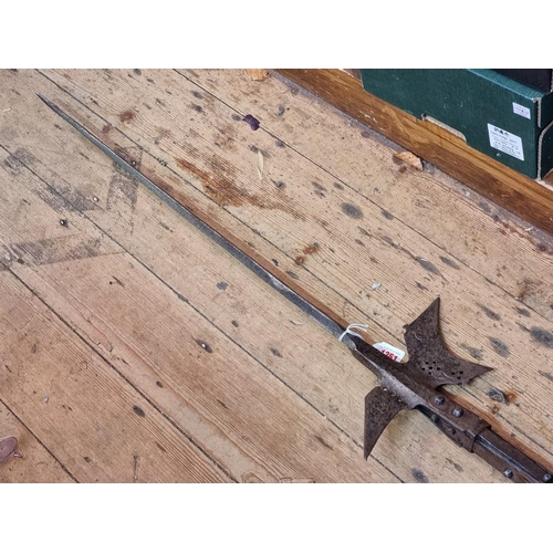 1351 - A steel halberd, with later ash shaft, total length 235cm.