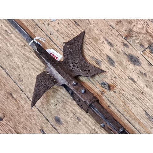 1351 - A steel halberd, with later ash shaft, total length 235cm.