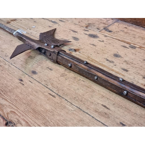 1351 - A steel halberd, with later ash shaft, total length 235cm.