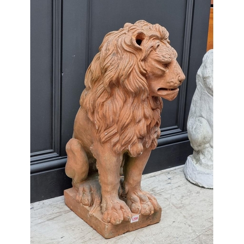 1209 - A terracotta seated lion, inscribed 'D. Ricceri Impruneta', 68cm high.  