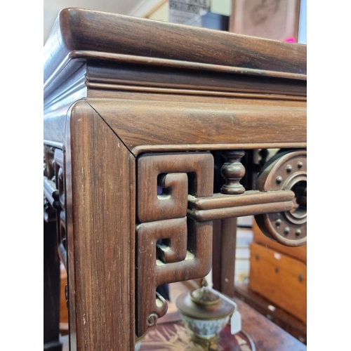 1085 - A Chinese carved hardwood low occasional table, 54cm high x 46.5cm wide. 