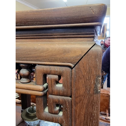 1085 - A Chinese carved hardwood low occasional table, 54cm high x 46.5cm wide. 