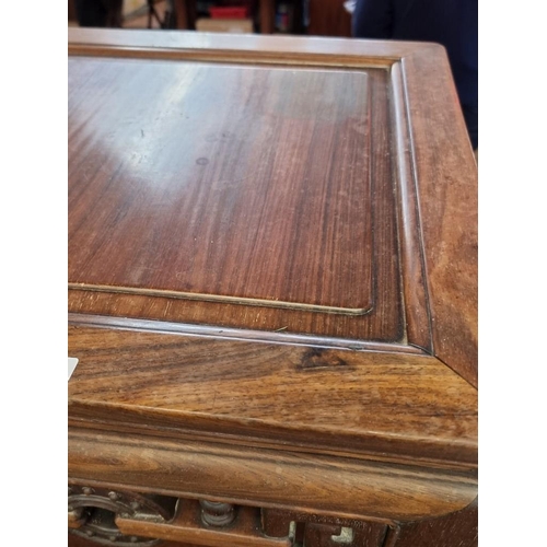 1085 - A Chinese carved hardwood low occasional table, 54cm high x 46.5cm wide. 