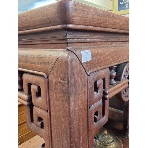 1085 - A Chinese carved hardwood low occasional table, 54cm high x 46.5cm wide. 