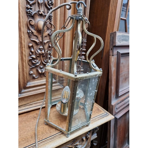 1194 - A set of three brass hexagonal ceiling lanterns, 40cm high.