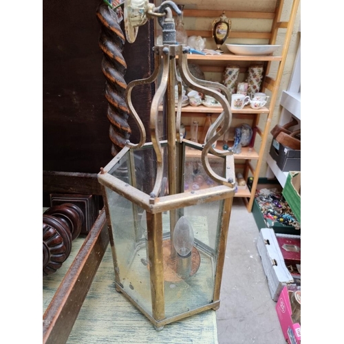 1194 - A set of three brass hexagonal ceiling lanterns, 40cm high.