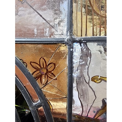 1339 - A stained and leaded glass rectangular panel, 93.5 x 53cm, (cracks to three small panels).... 