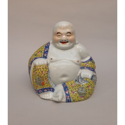 1411 - A Chinese famille rose Buddha, mark to base, 26cm high.
