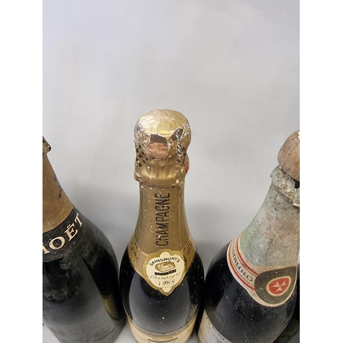 104 - A mixed group of wine and champagne, to include two old bottles of Moet & Chandon NV. (8)... 