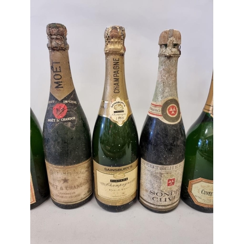 104 - A mixed group of wine and champagne, to include two old bottles of Moet & Chandon NV. (8)... 