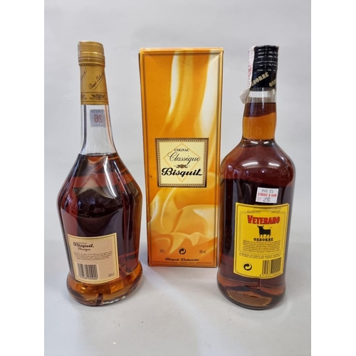 26 - Two 1 litre bottles of brandy, comprising: Bisquit Classique cognac, in oc; and Osborne Veterano bra... 