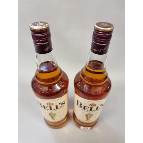 32 - Two 1 litre bottles of Bell's blended whisky. (2)