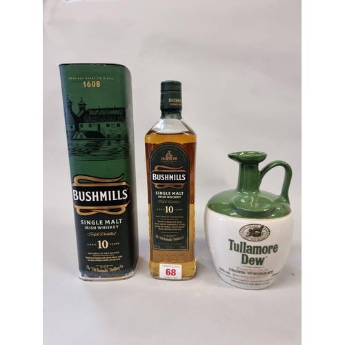 68 - Two 70cl bottles of Irish whiskey, comprising: a flagon of Tullamore Dew; and a Bushmills 10 year ol... 