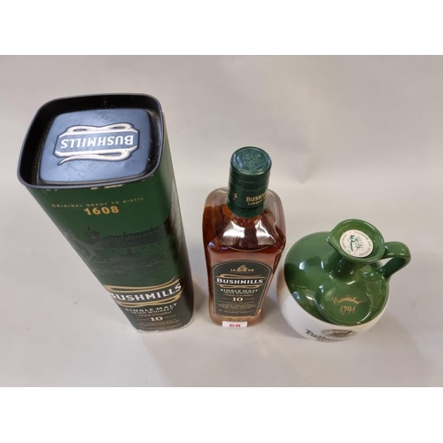 68 - Two 70cl bottles of Irish whiskey, comprising: a flagon of Tullamore Dew; and a Bushmills 10 year ol... 