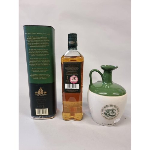 68 - Two 70cl bottles of Irish whiskey, comprising: a flagon of Tullamore Dew; and a Bushmills 10 year ol... 