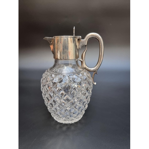 308 - An Edwardian silver mounted hobnail cut glass claret jug, by The Goldsmiths & Silversmiths Compa... 