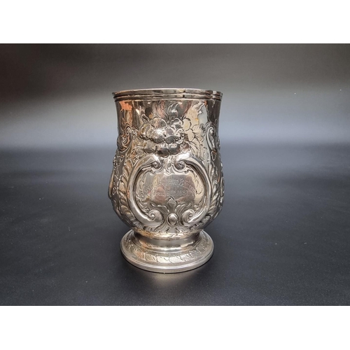 314 - A George III silver baluster pint mug, having later embossed decoration, by Peter & Anne Bateman... 