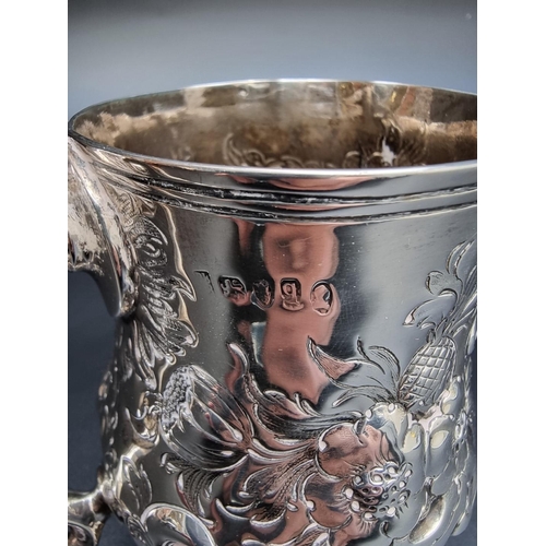 314 - A George III silver baluster pint mug, having later embossed decoration, by Peter & Anne Bateman... 