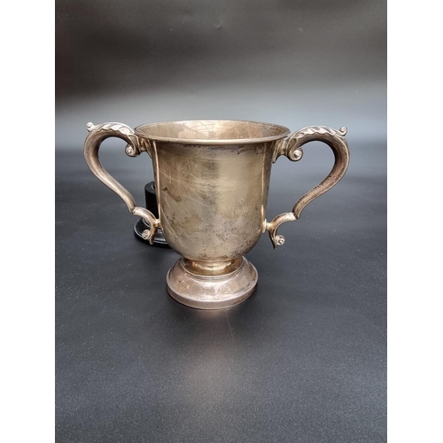 315 - A silver twin handled trophy cup by Walker & Hall, Sheffield 1917, 12.5cm high, 255g.... 