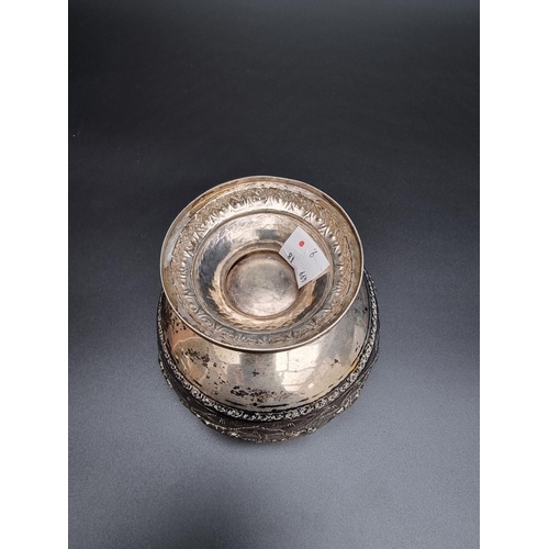 316 - A Colonial white metal circular sugar bowl, the rim decorated exotic animals to include elephants an... 