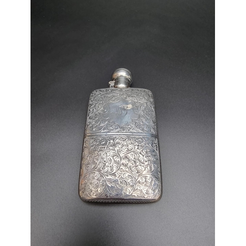 330 - An Edwardian silver hip flask, having chased floral scroll decoration, by Hilliard & Thomason, B... 