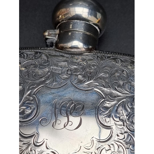 330 - An Edwardian silver hip flask, having chased floral scroll decoration, by Hilliard & Thomason, B... 