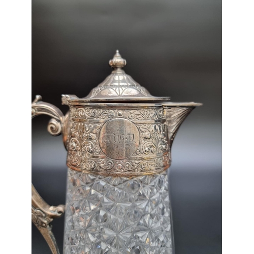 331 - A Victorian silver mounted cut glass claret jug by Charles Edwards, London 1885, 28.5cm. (s.d).... 