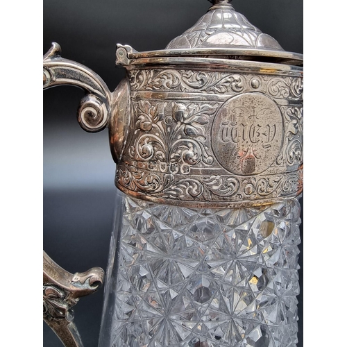 331 - A Victorian silver mounted cut glass claret jug by Charles Edwards, London 1885, 28.5cm. (s.d).... 