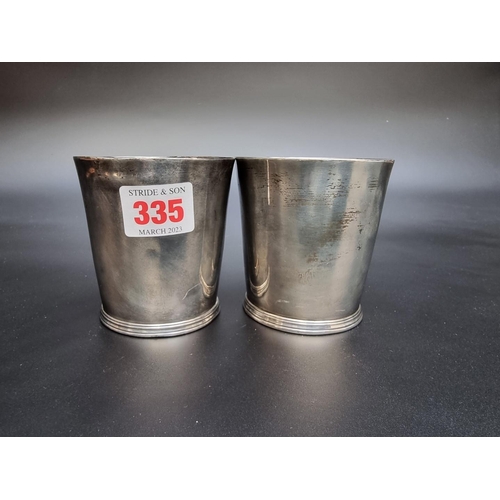 335 - A pair of George III silver beakers, by Thomas Chawner London 1786, engraved initials, 8cm high, the... 