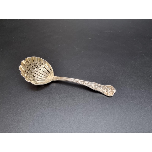 391 - A Victorian Bacchanalian pattern silver sifter spoon, by Goldsmiths & Silversmiths Co, London 18... 