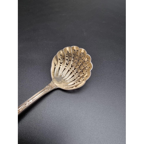 391 - A Victorian Bacchanalian pattern silver sifter spoon, by Goldsmiths & Silversmiths Co, London 18... 