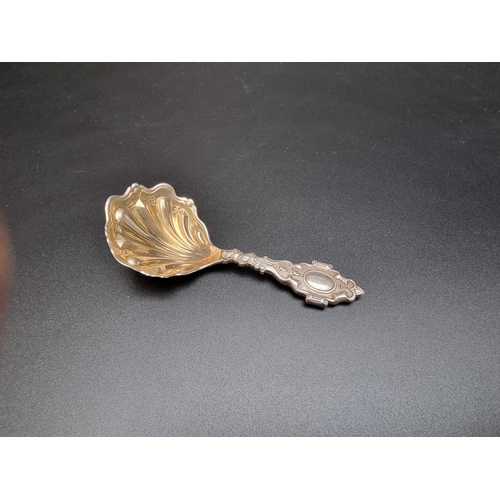 392 - A Victorian silver shell caddy spoon, by Francis Higgins, London 1886, 25g.