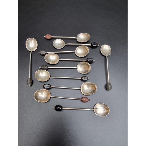 407 - Eleven various silver bean handled coffee spoons, gross weight 68g.