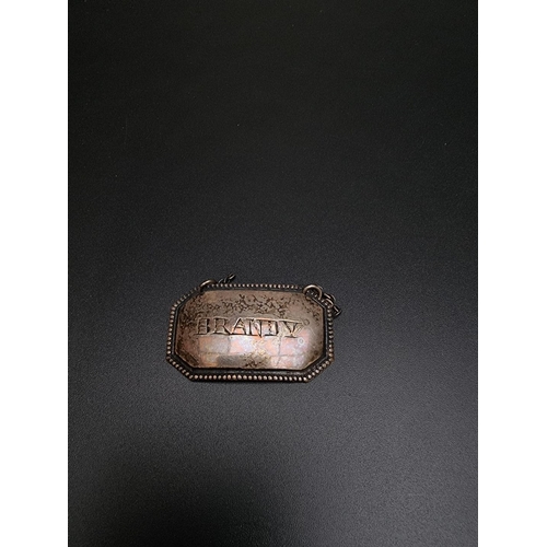 409 - A George IV silver sherry decanter label, by Samuel Dutton, London 1825; together with two plated ex... 