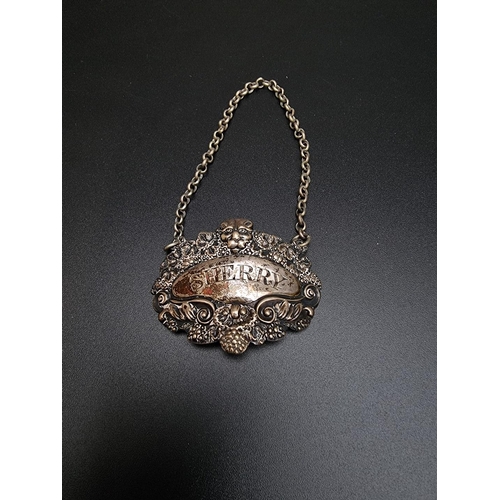 409 - A George IV silver sherry decanter label, by Samuel Dutton, London 1825; together with two plated ex... 